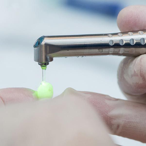 Dental laser treating crown
